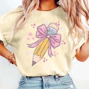 Just in ✏️| Back to School Cream Graphic Tee with Pink Bow Pencil Design